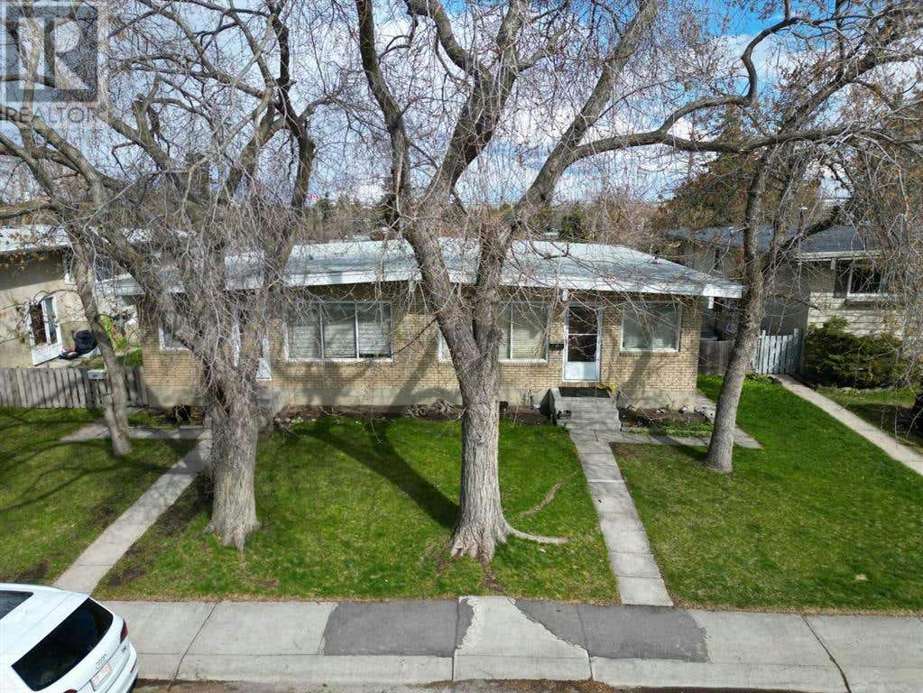 7106 & 7108 Hunterville Road NW, Calgary, AB T2K4J8 Duplex For Sale